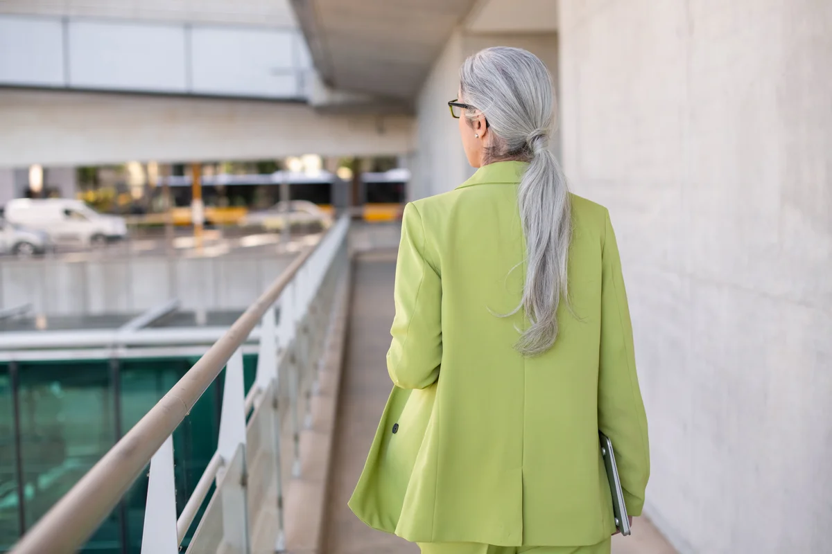woman with gray hair wearing lime green