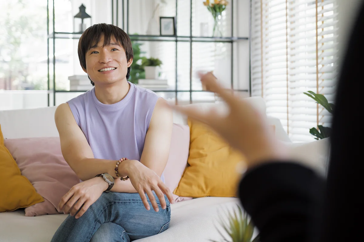 on-binary influencer sitting easy at home sofa