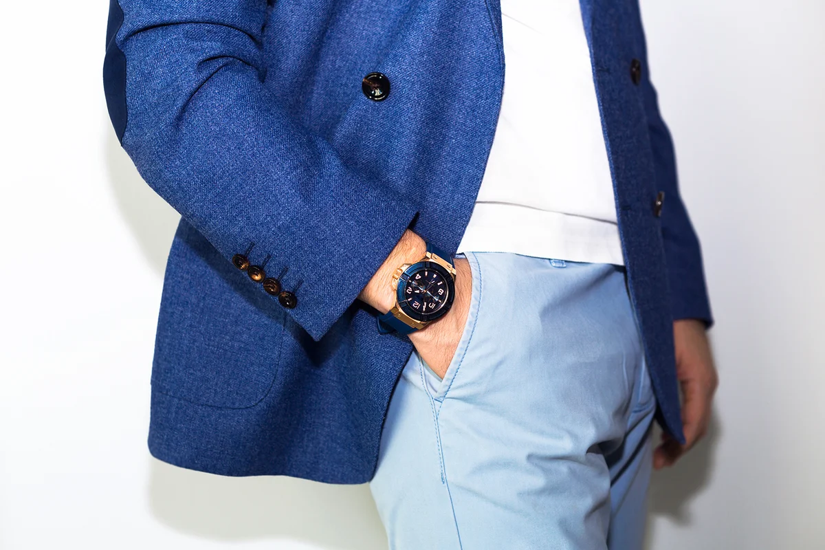 Man's hand in blue pants pocket