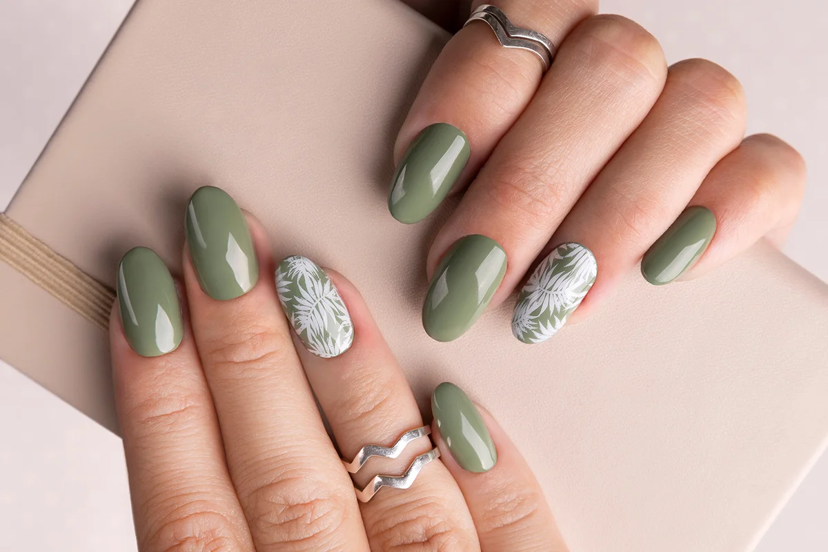 Beautiful womans hands with spring summer floral nail design