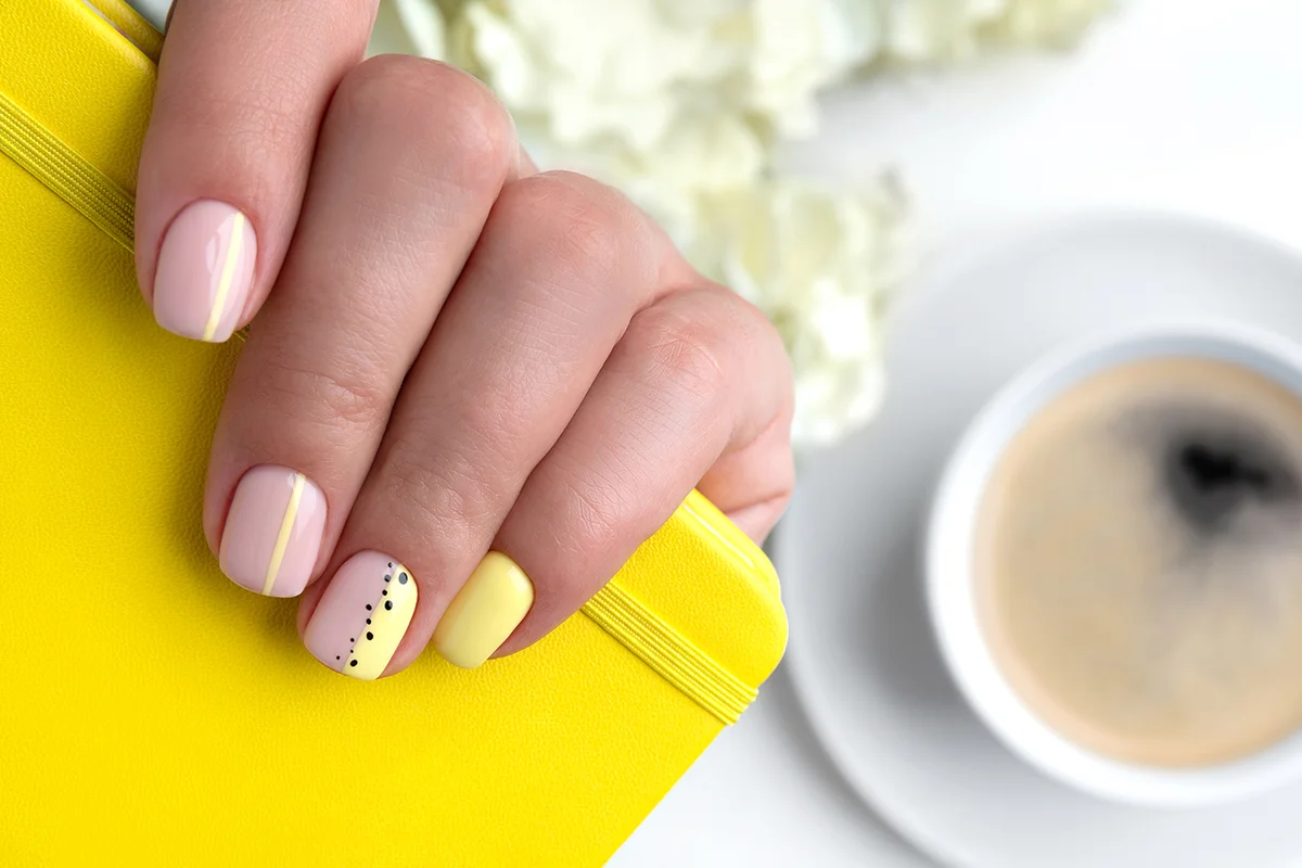 Woman's hands with spring summer nail design