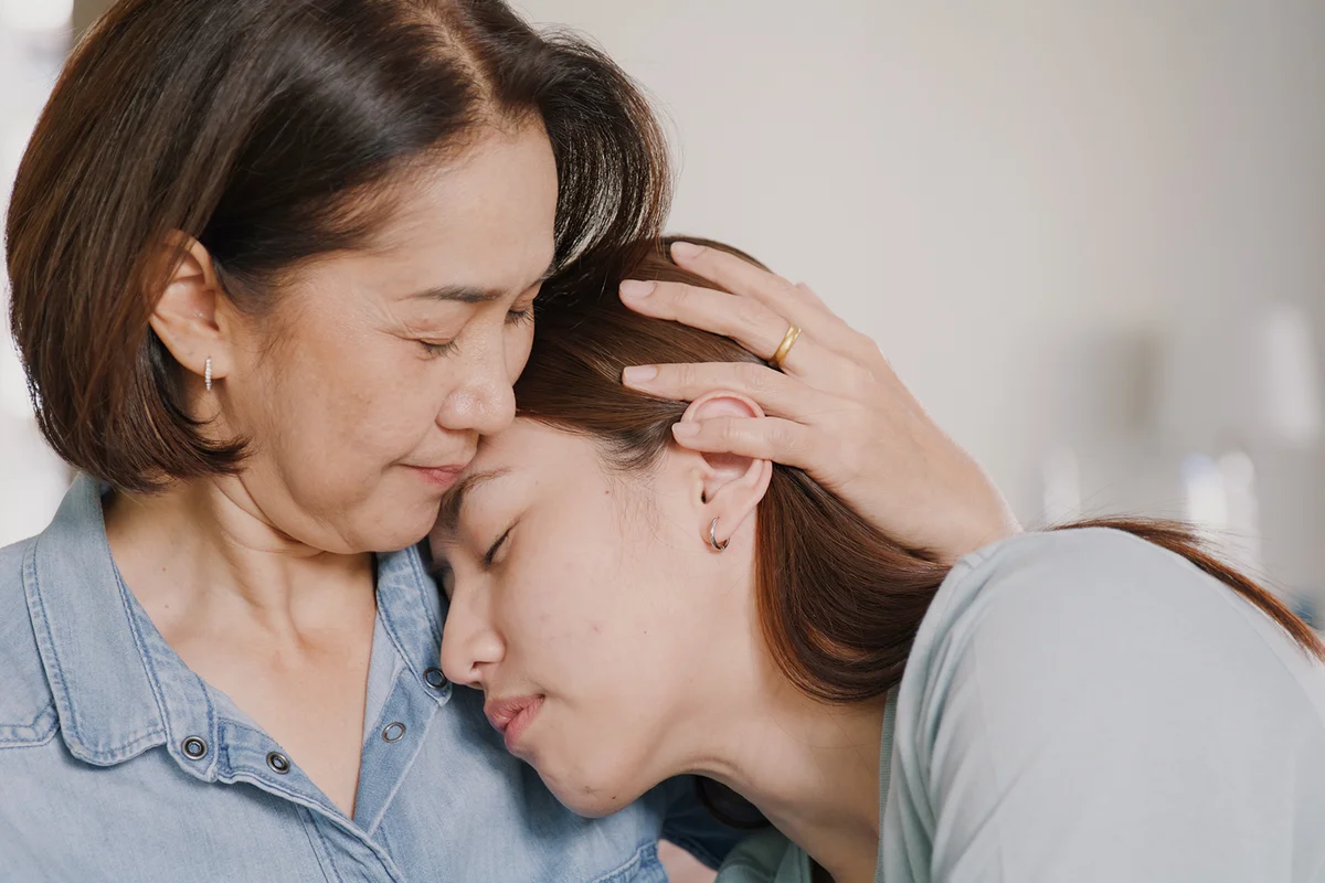 Mom and daugther hugging