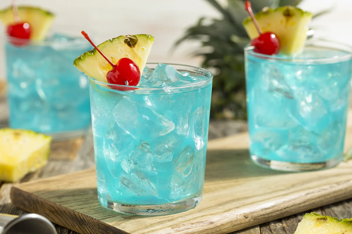 Refreshing Blue Hawaii Cocktail Punch with Pineapple and Cherry