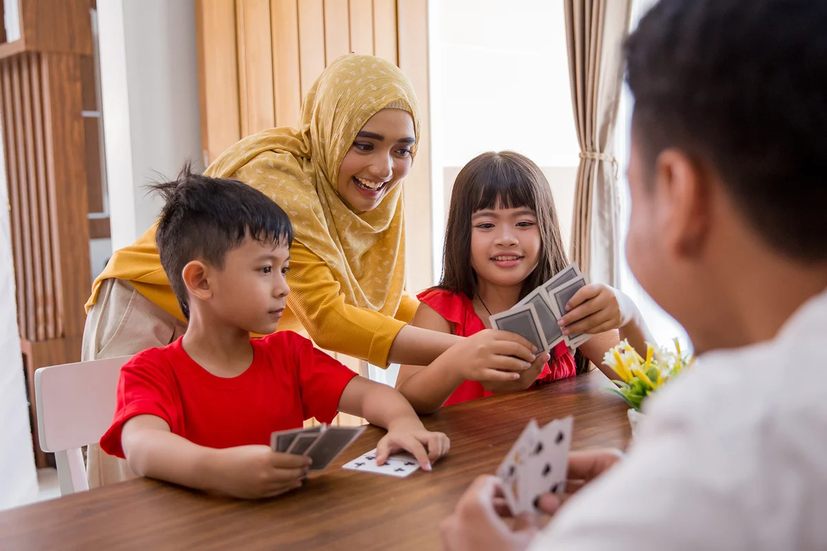 family playing fun card game together at home
