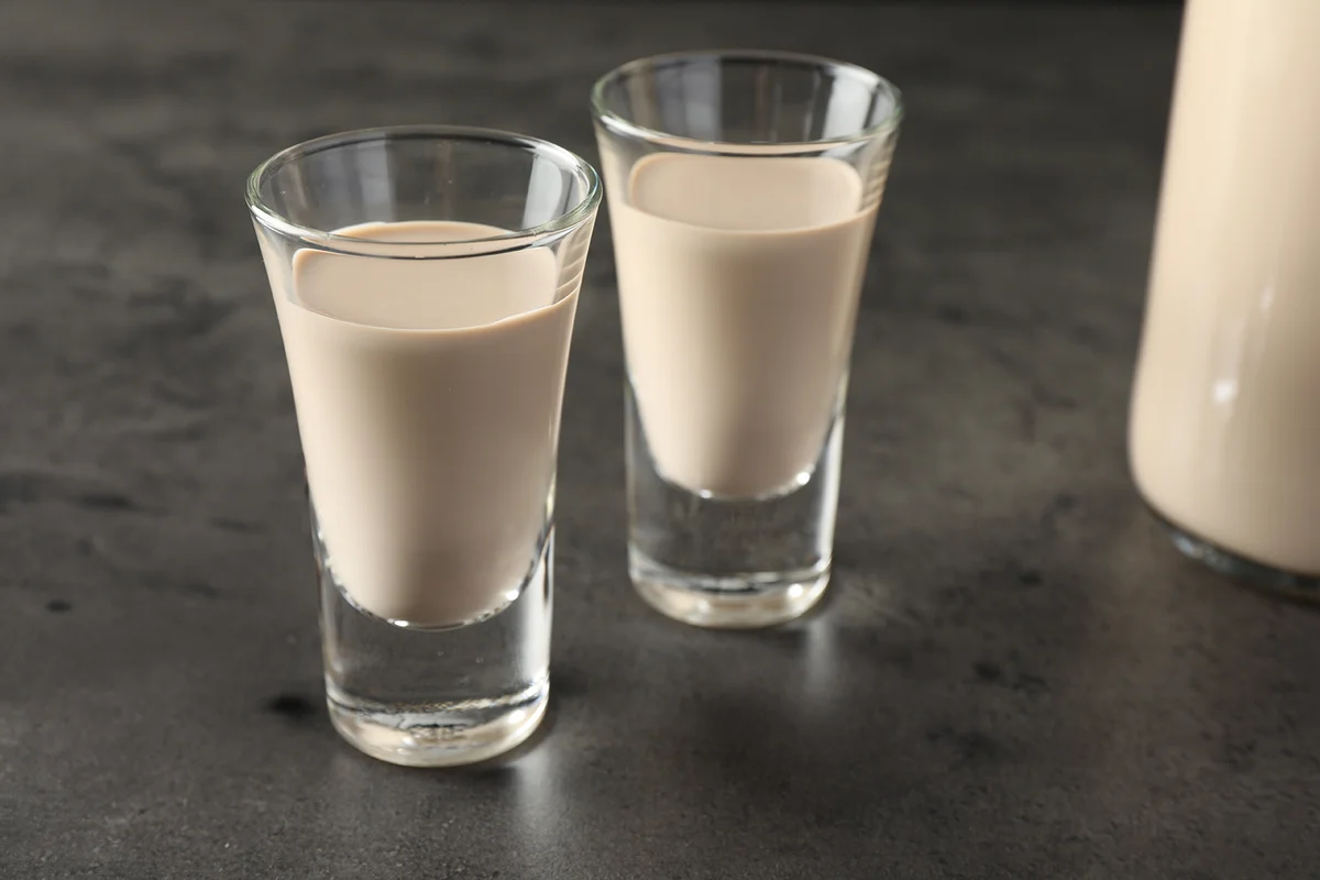 cream liqueur in glasses on grey table