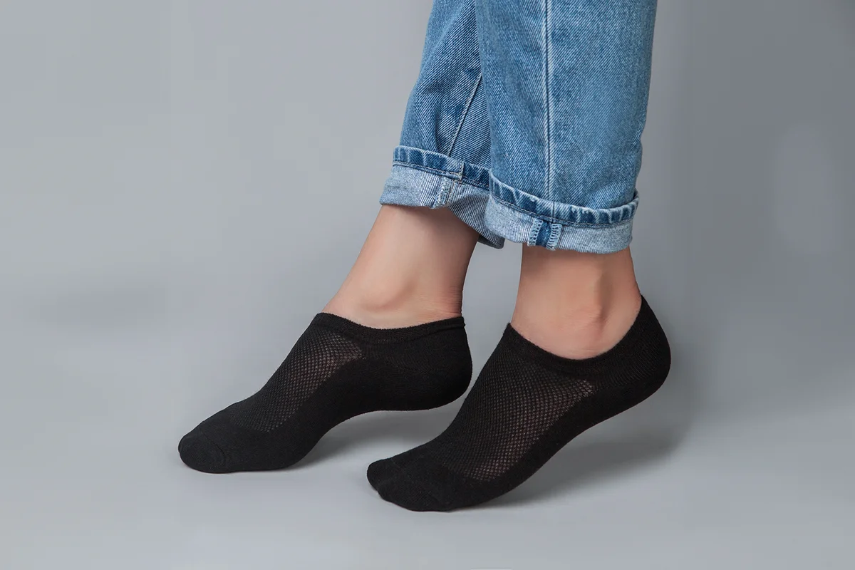 beautiful woman's legs in black socks