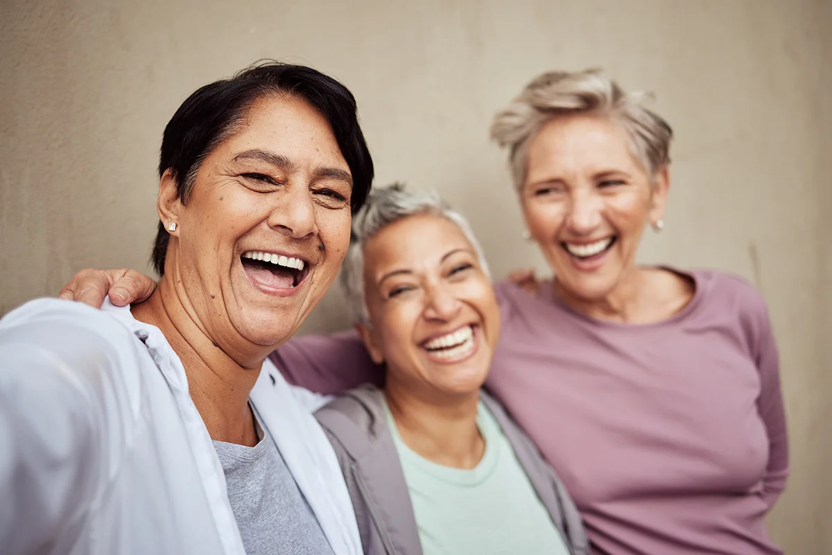 Portrait of elderly female friends, sports and wellness on wall background