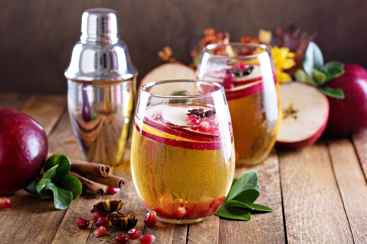 Apple cider fall cocktail with spices and pomegranate