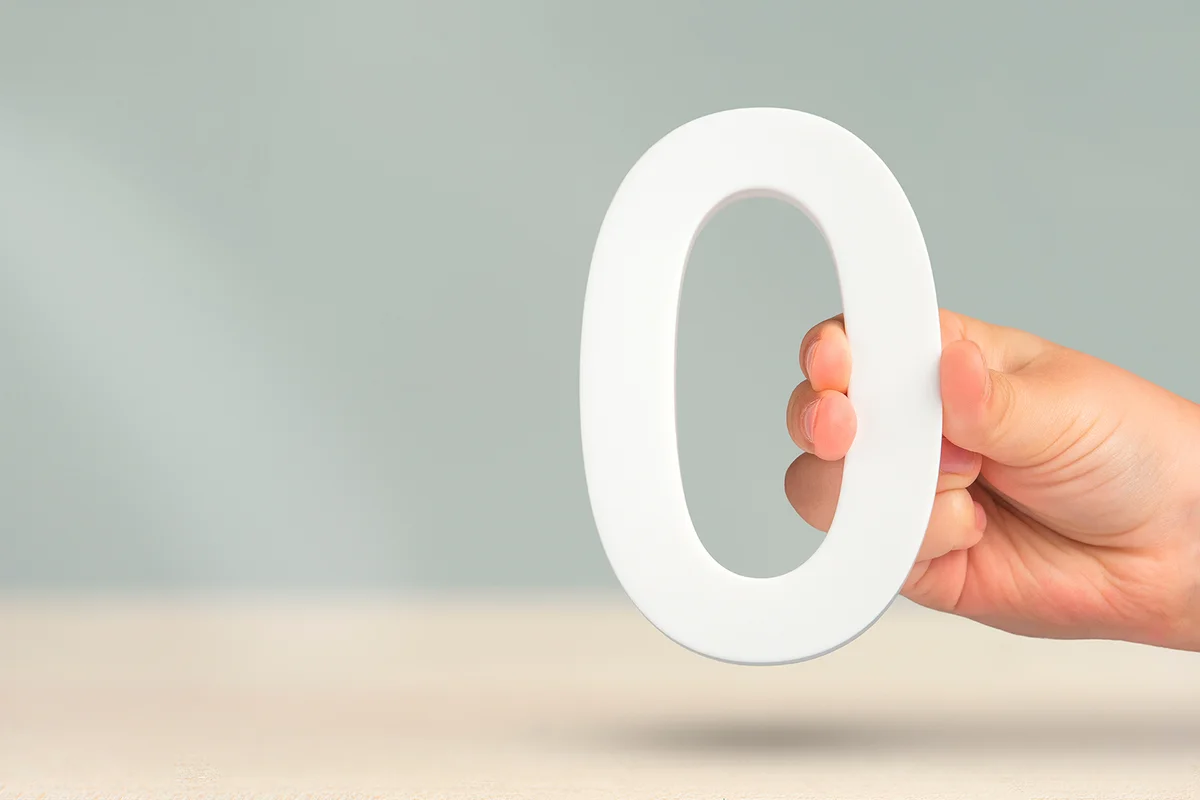 Numeral zero in hand