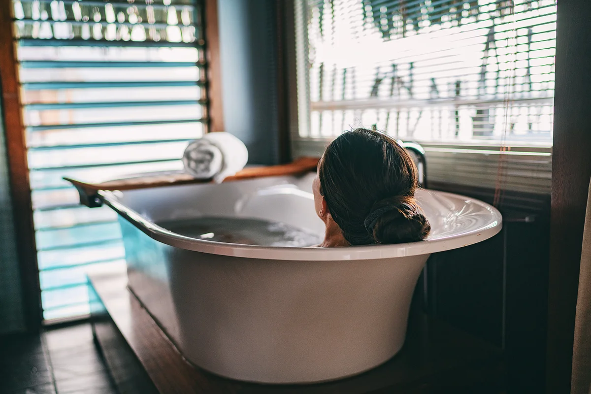woman relaxing in bathtub