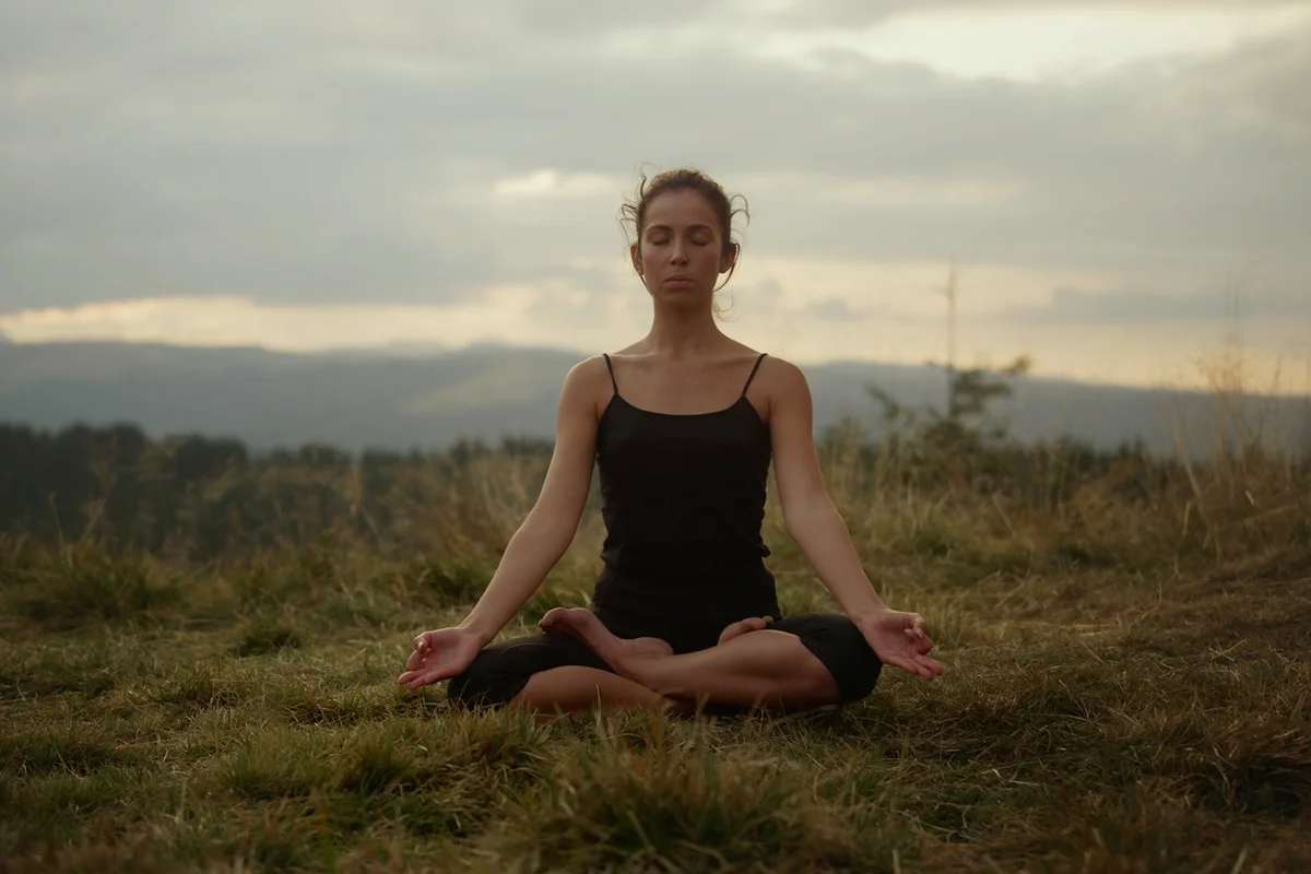 Focused woman meditating in nature