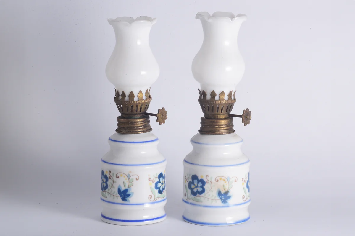 Two vintage porcelain oil lamps