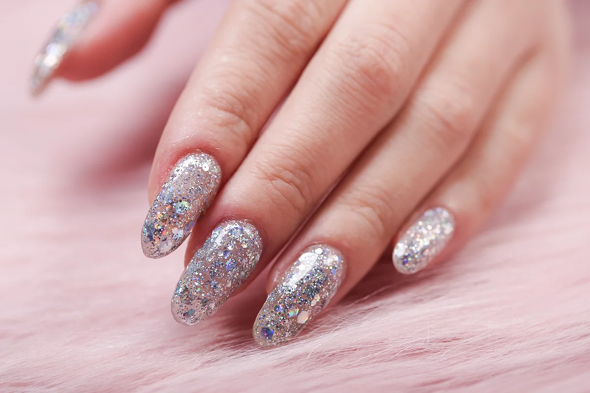 Glitter silver nail polish manicure