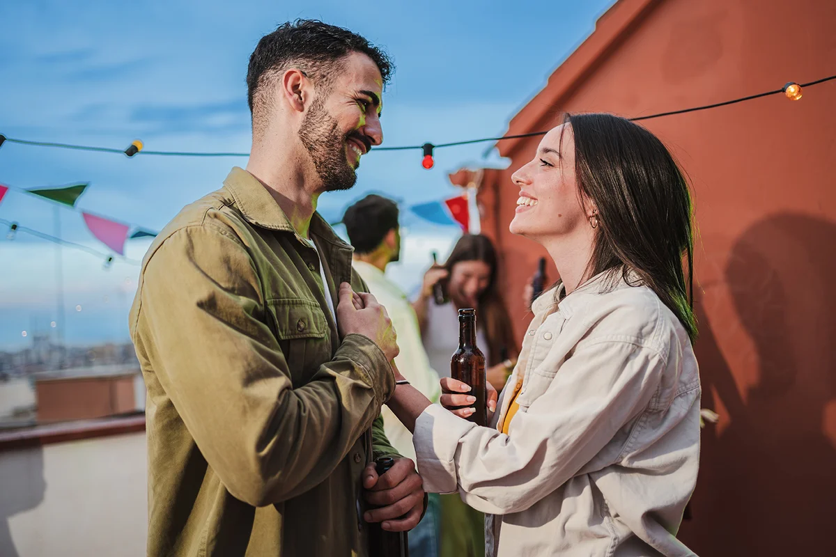 Smiling young couple flirting