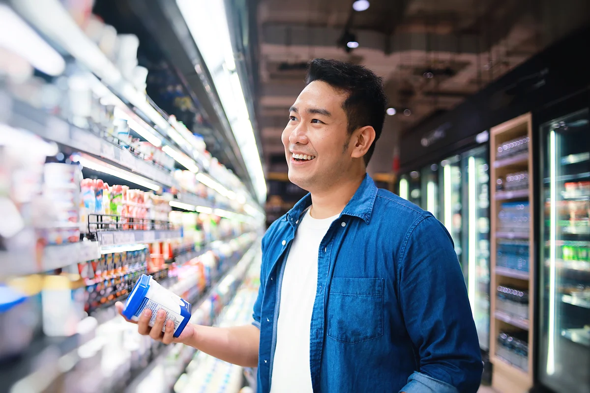 man in casual blue shirt shopping in supermarket.