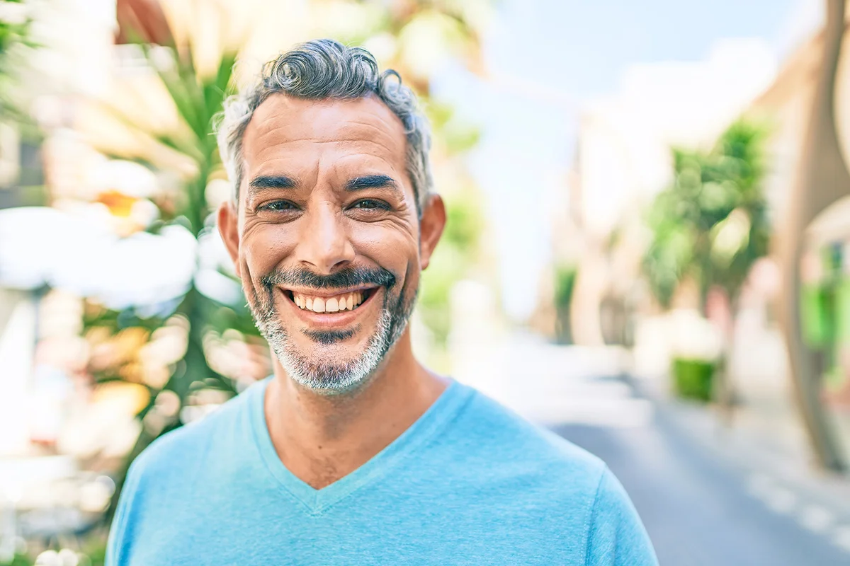 man smiling happy walking at street of city