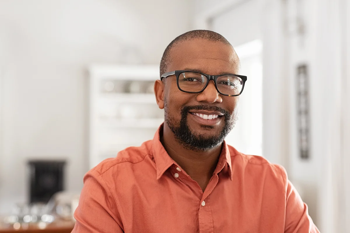 man wearing spectacles looking at camera