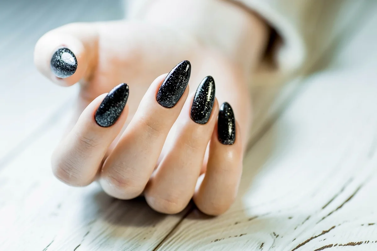 Gorgeous manicure, black nail polish with sequins