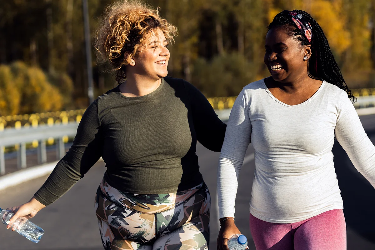 Two young women jogging together