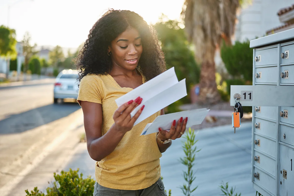 african american woman checking mail in las vegas community