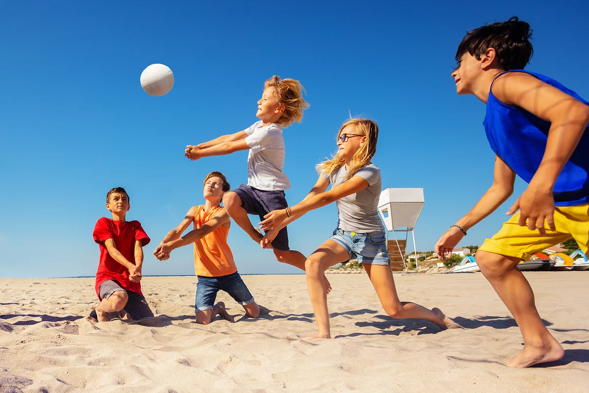 Volleyball players making a bump pass on the beach