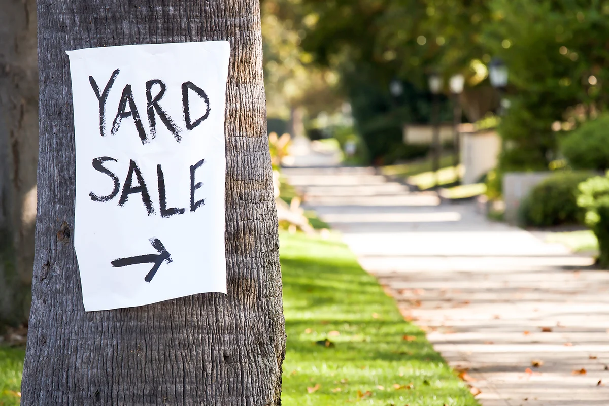 Hand painted paper yard sale sign