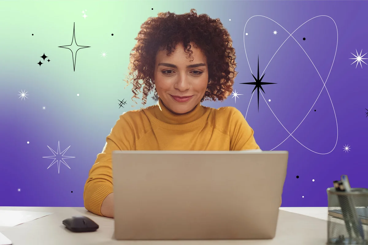Woman Sitting at a Desk in Creative Office