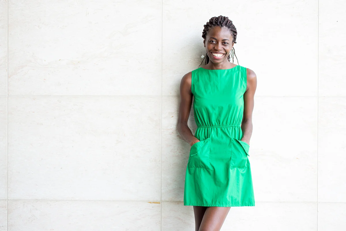 Smiling woman in green dress