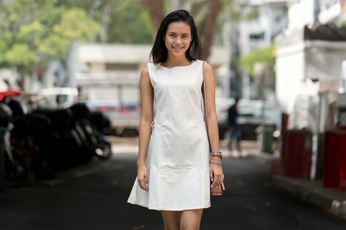 girl in a white shift dress
