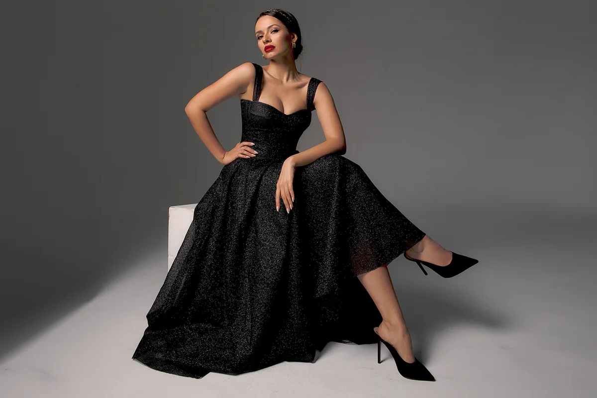 Elegant lady in black shiny ball gown