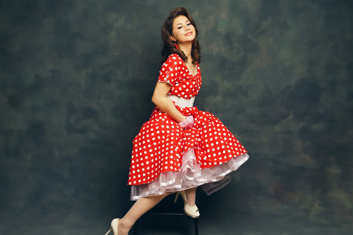 Beautiful pinup girl smiling posing