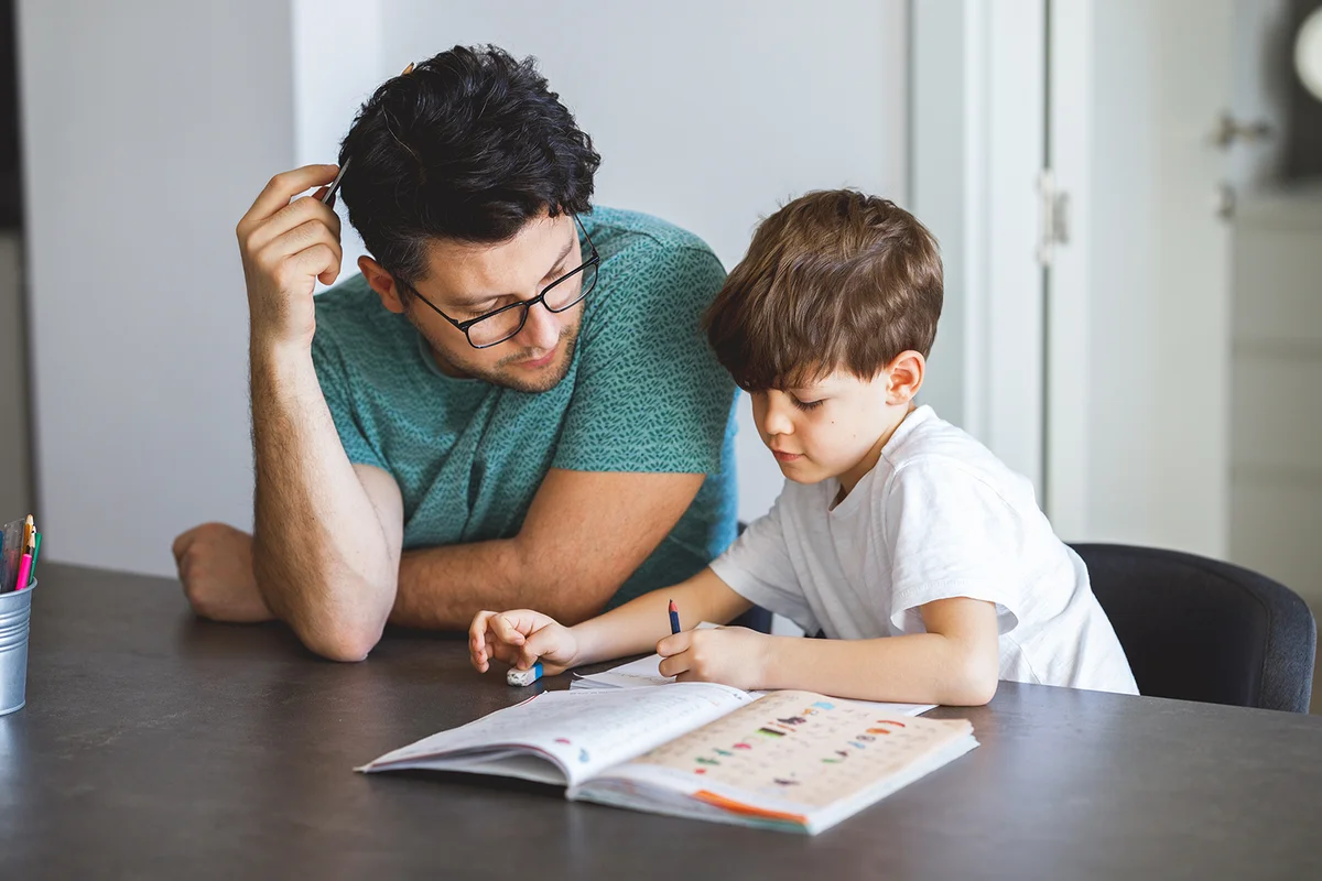 Young Father homeschooling his son