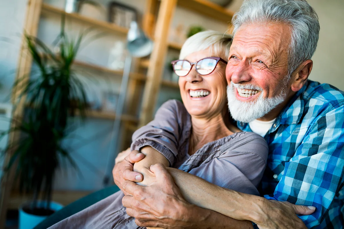 Elderly couple in love. Senior husband and wife hugging and bonding with true emotions