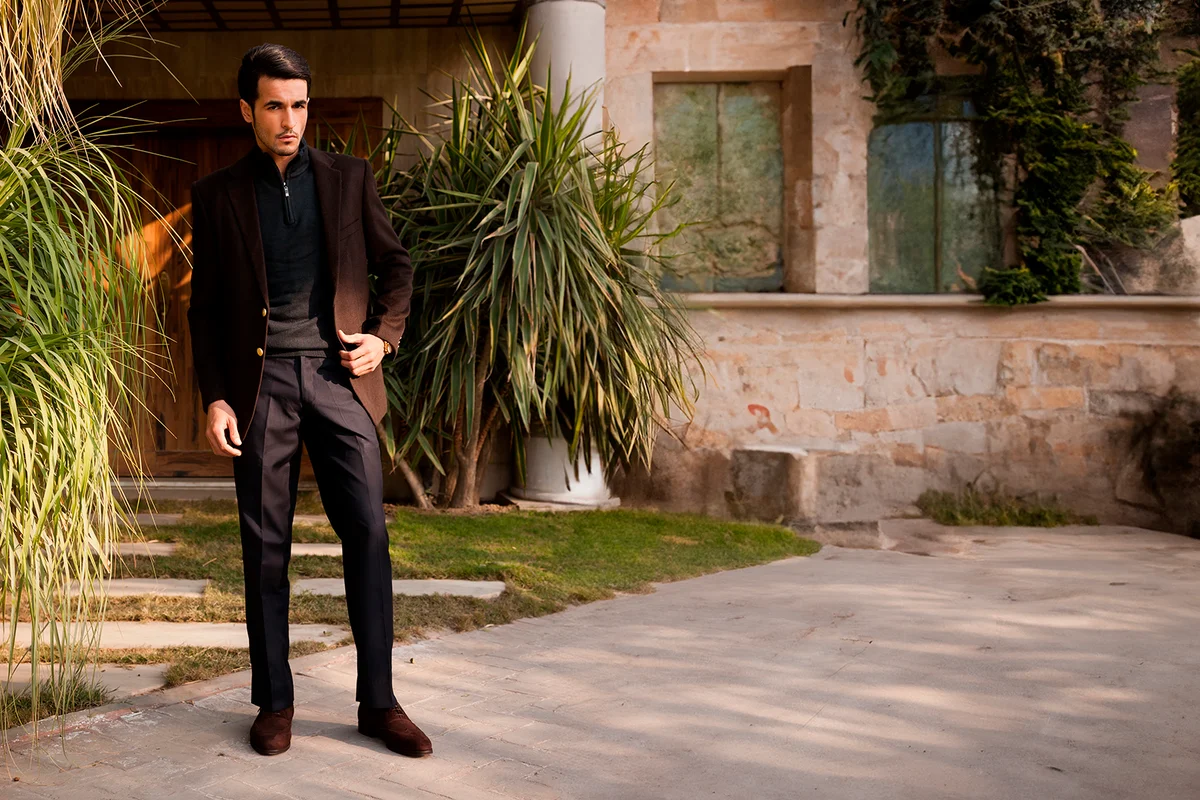 full length portrait of handsome young man with attitude, young male fasion model wearing winter's attire