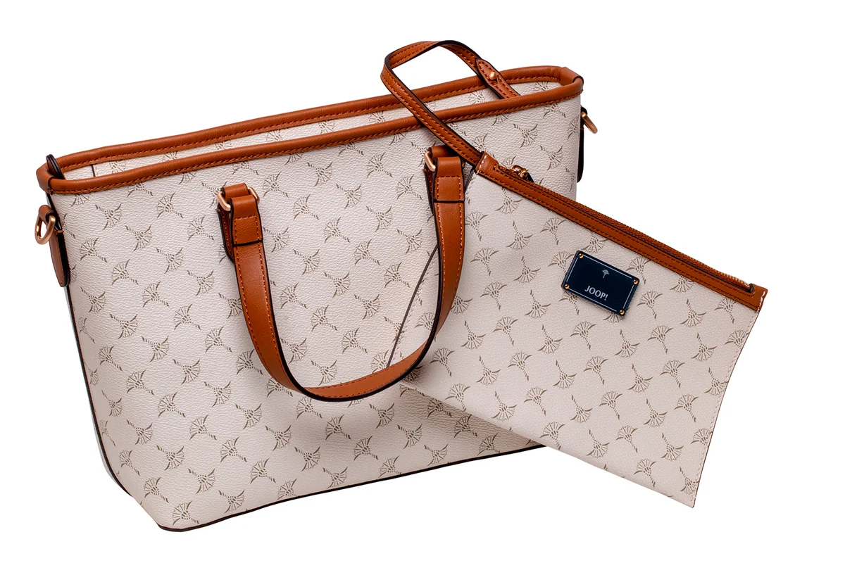 Berlin, Germany - March 19, 2021: Close-up of a luxurious light beige Joop leather handbag or shoulder bag with cosmetic bag isolated on white. Clipping path. Joop is a famous luxury fashion brand all