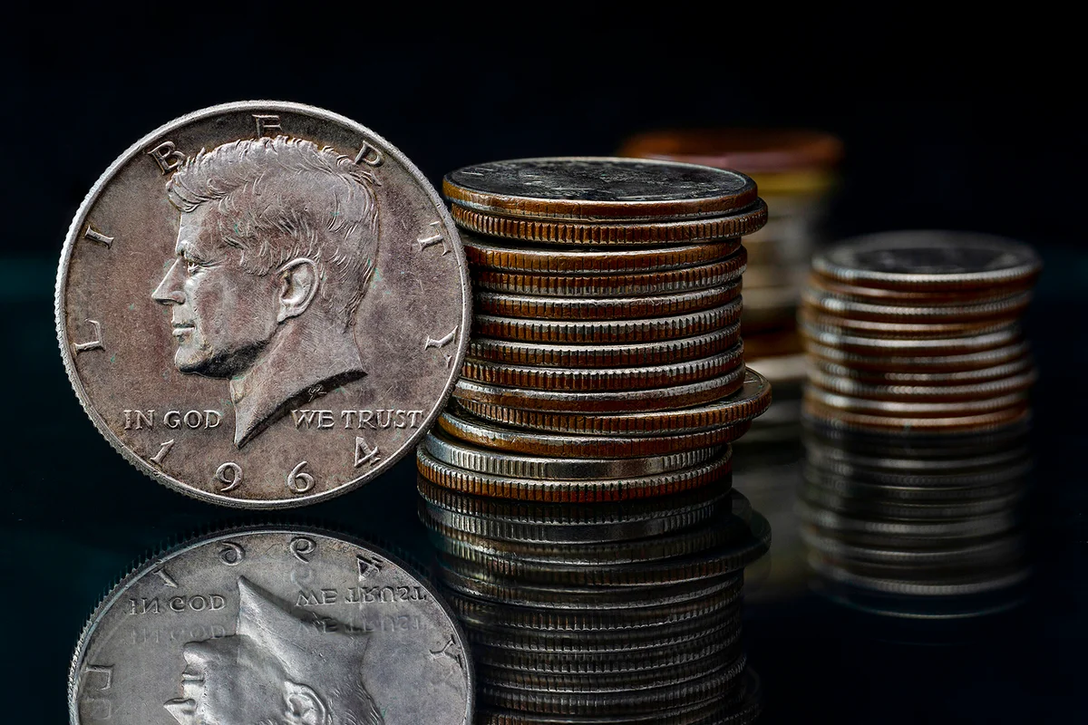 US Half Silver Dollar John Fitzgerald Kennedy 1964 Coin Stacks Blurred Background Reflection