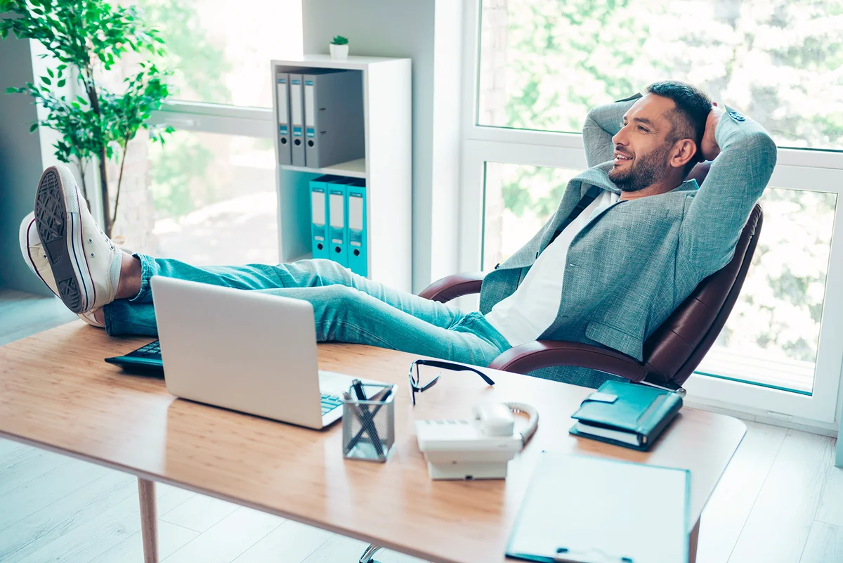 Close up side profile photo handsome he him his macho guy hands arms behind head napping resting overjoyed refreshment notebook table sit office chair wear formal wear jacket blazer jeans denim