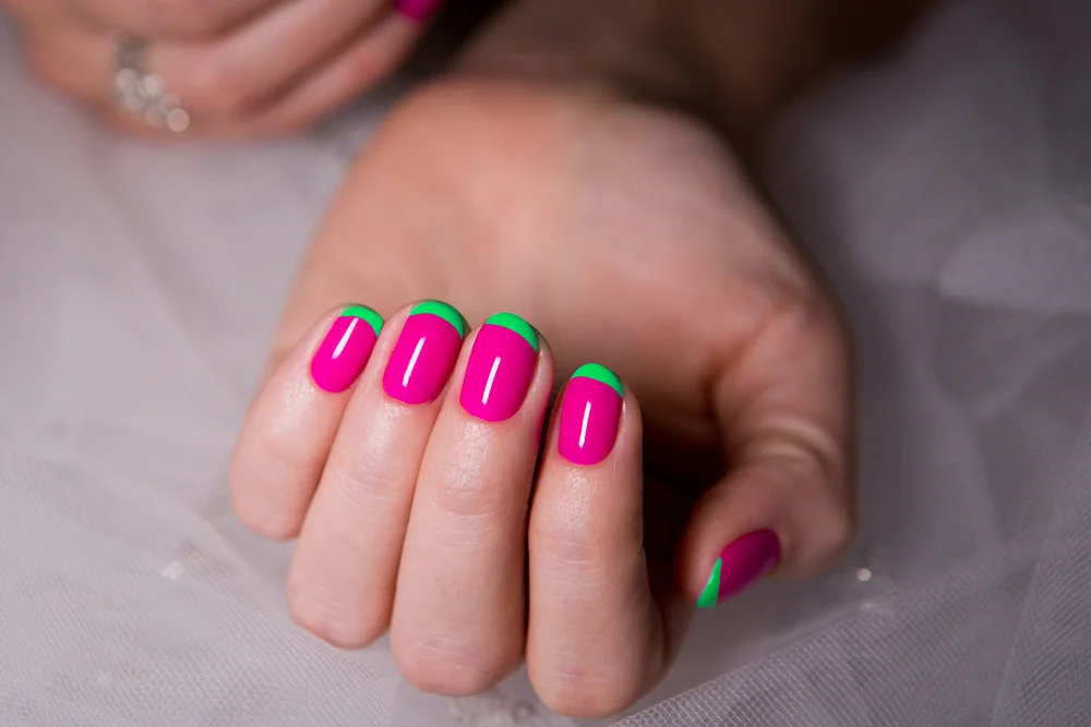 Bright pink and fluir green french manicure