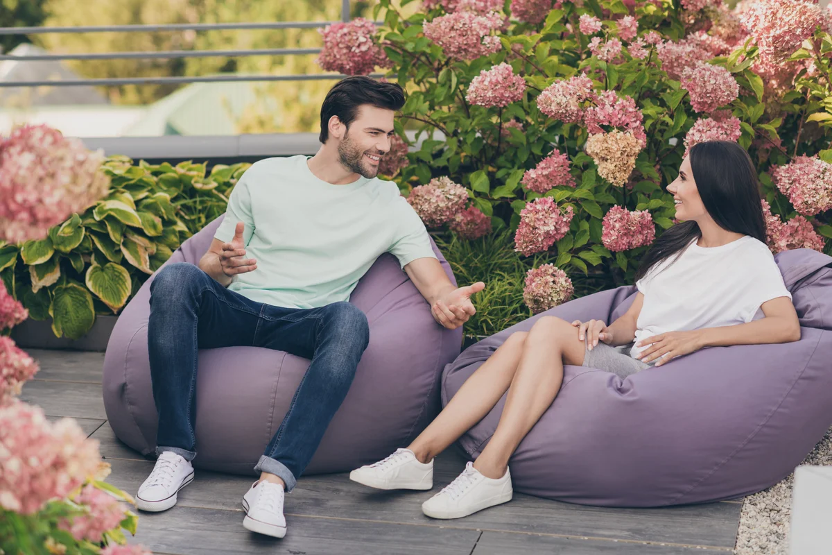 couple talking on beanbag chairs