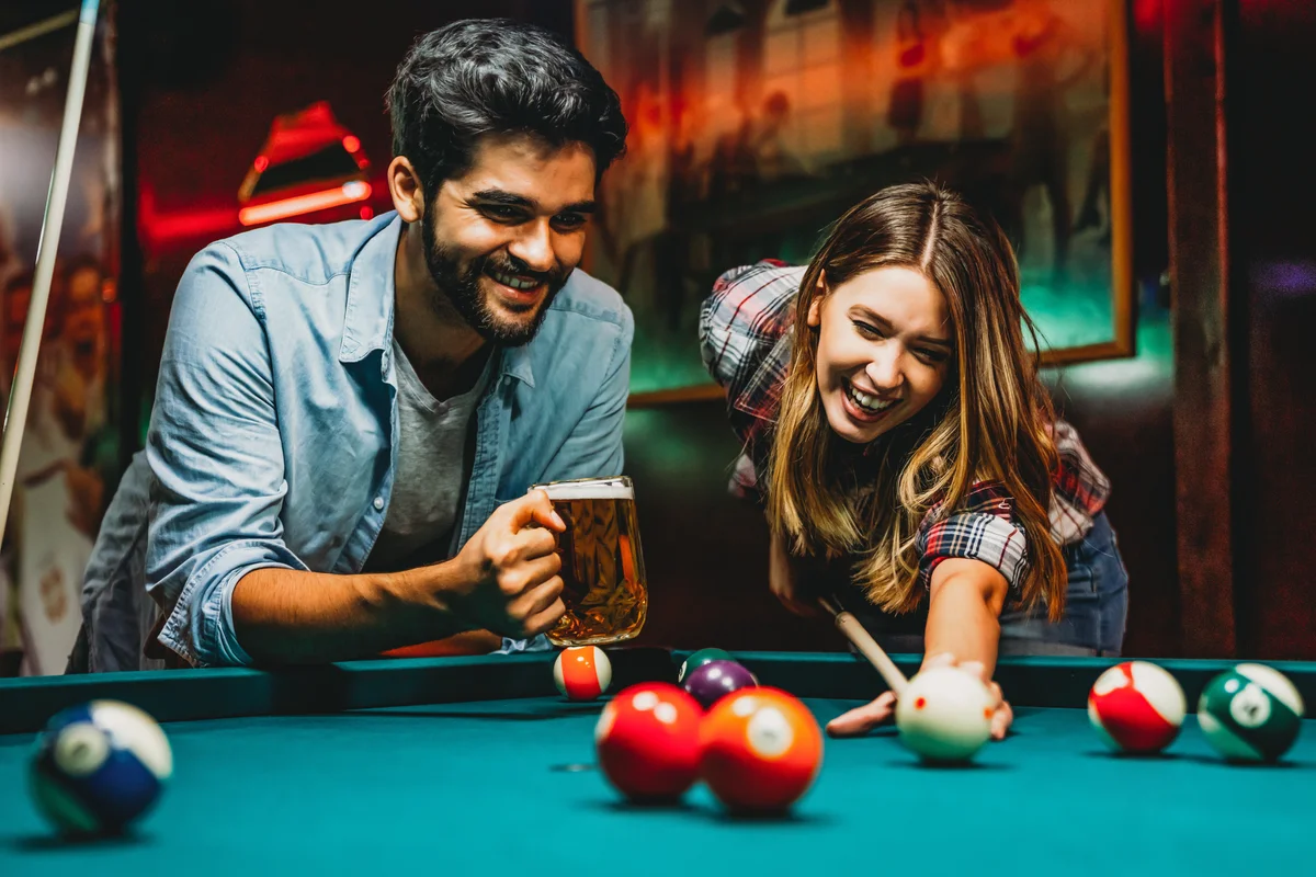 couple playing pool