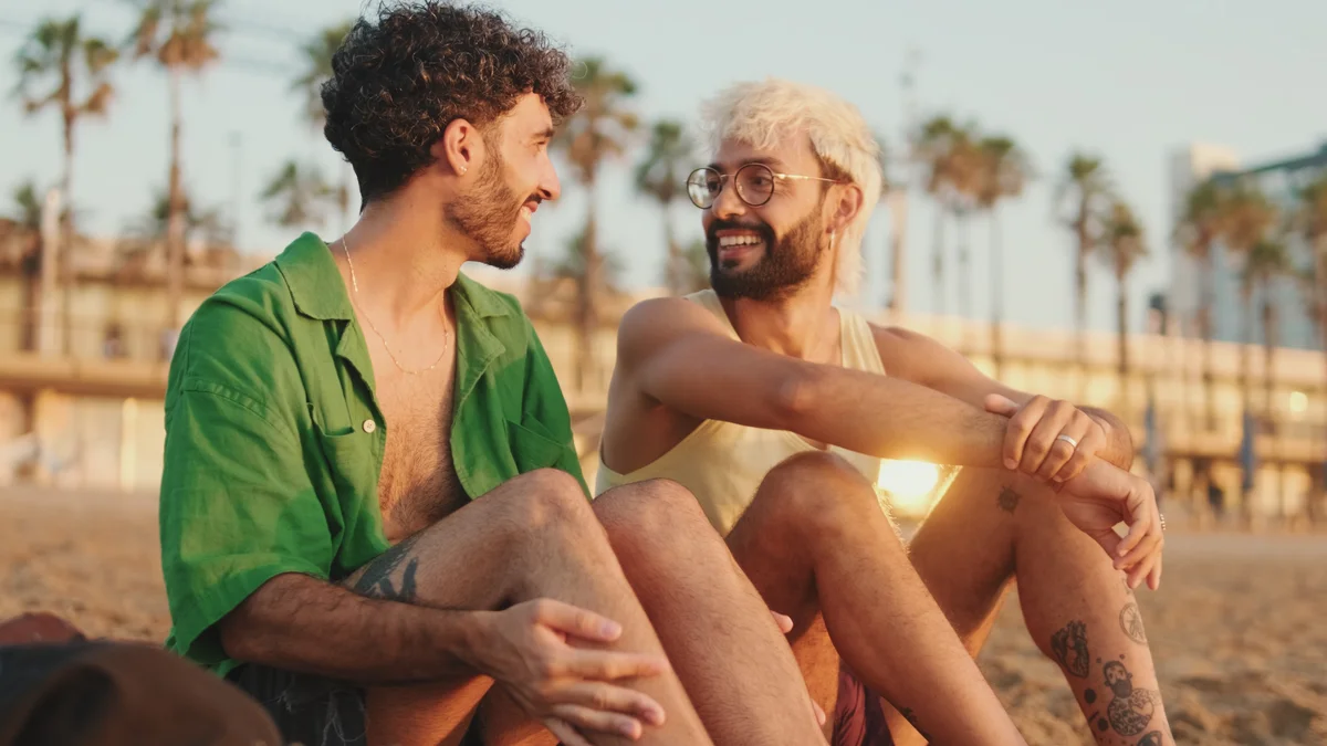 couple having a conversation on the beach