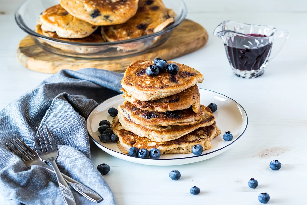 blueberry pancakes with blueberry syrup and fresh blueberries