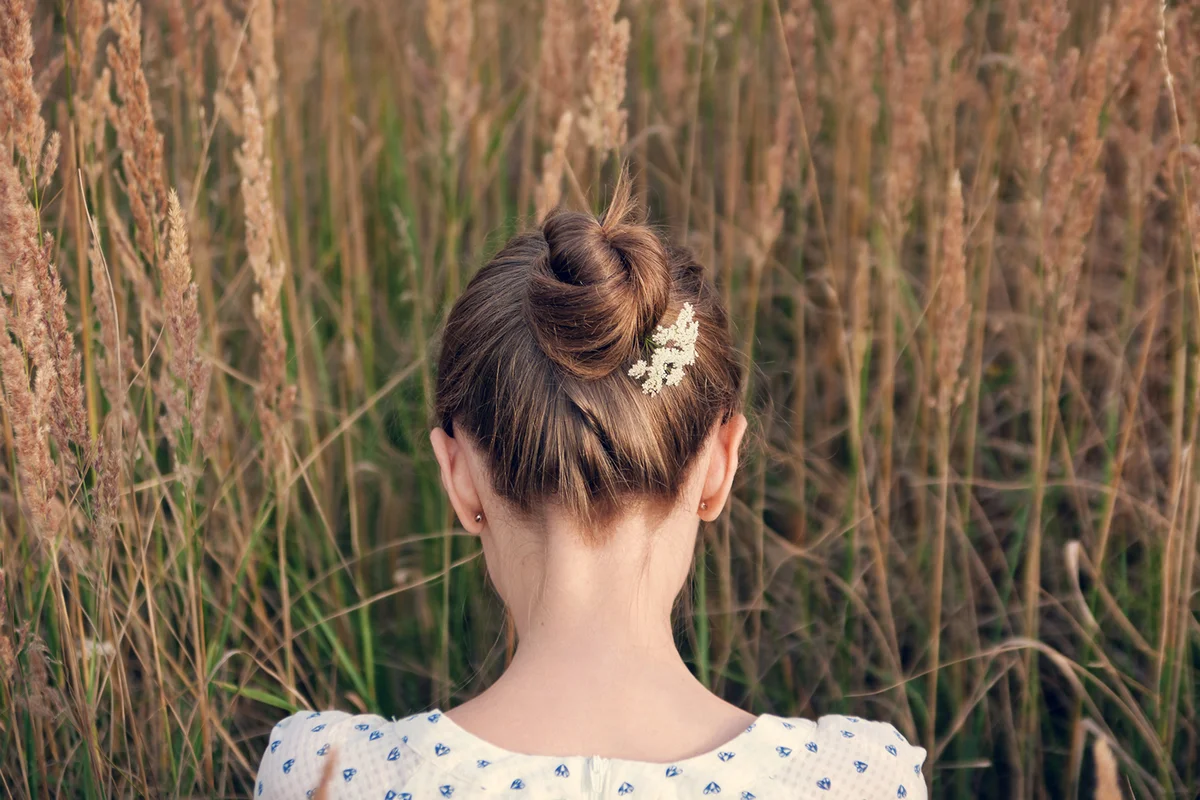 Back view of young woman with hair bun
