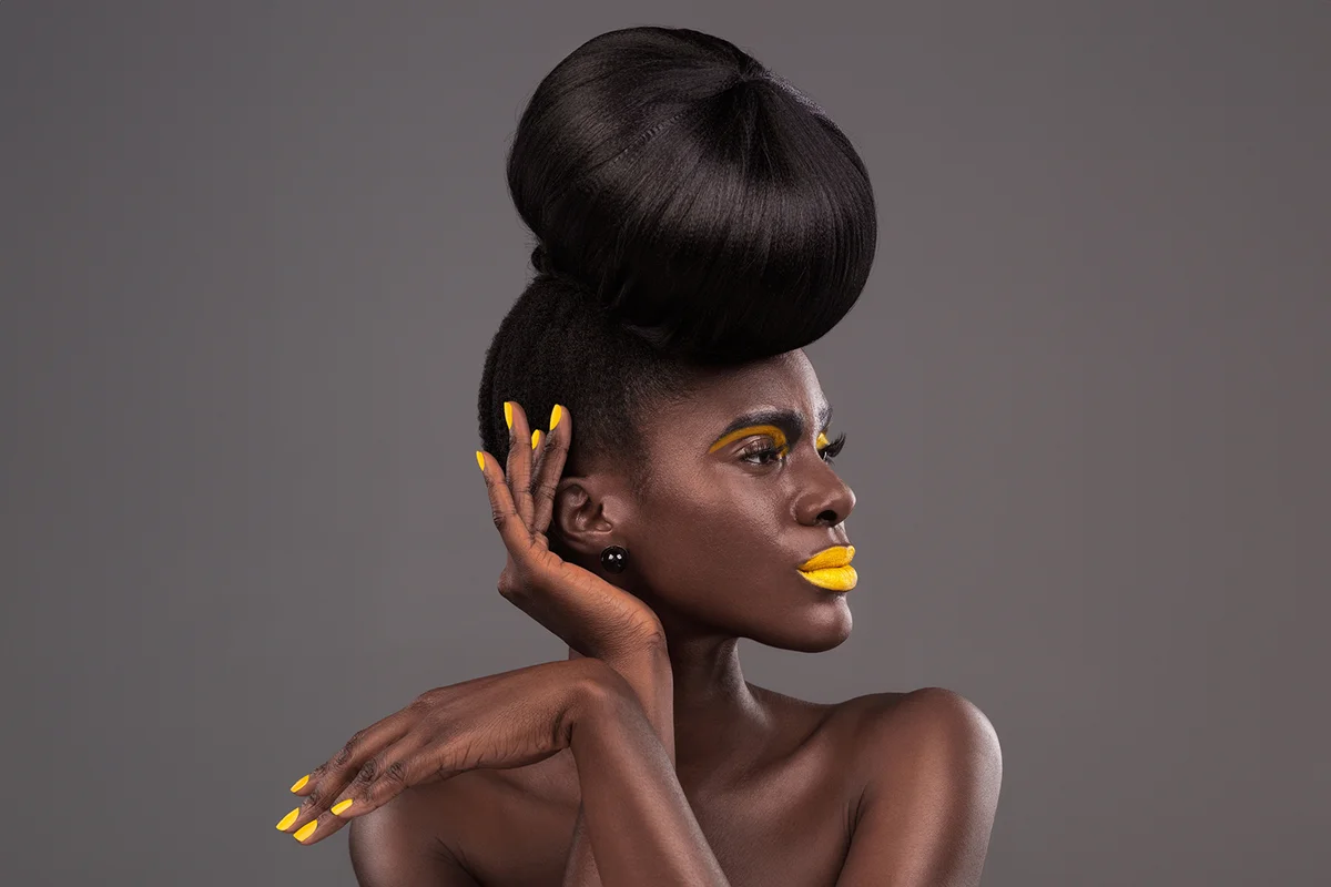 African, model and studio face with creative, beauty and cosmetic yellow lipstick.