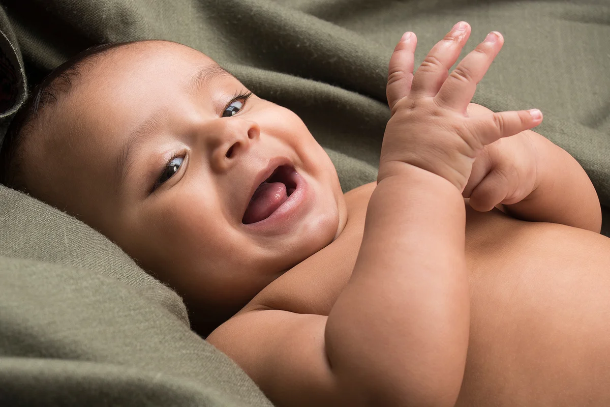 Indian baby boy happily smiling