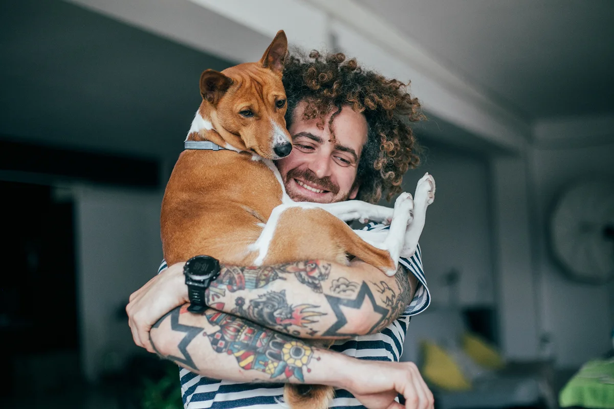 Best friends hugging dog and hipster