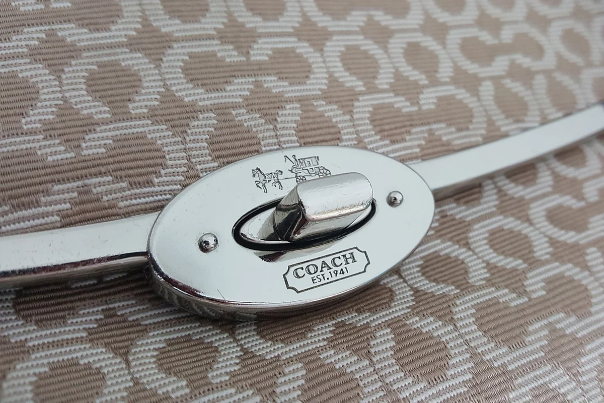 PUTRAJAYA, MALAYSIA - SEPTEMBER 5TH, 2016: Close up image on coach handbag button.