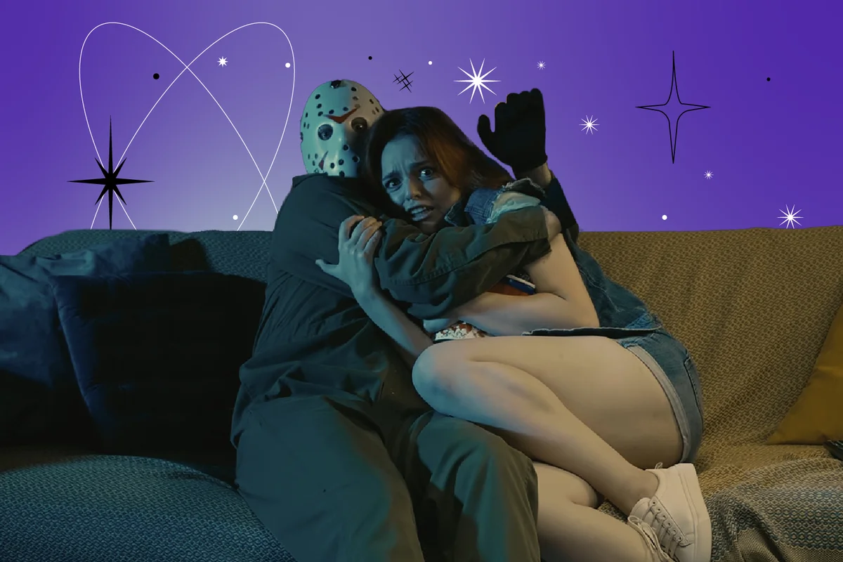 Man horror maniac sitting on the sofa with girl, watching movie