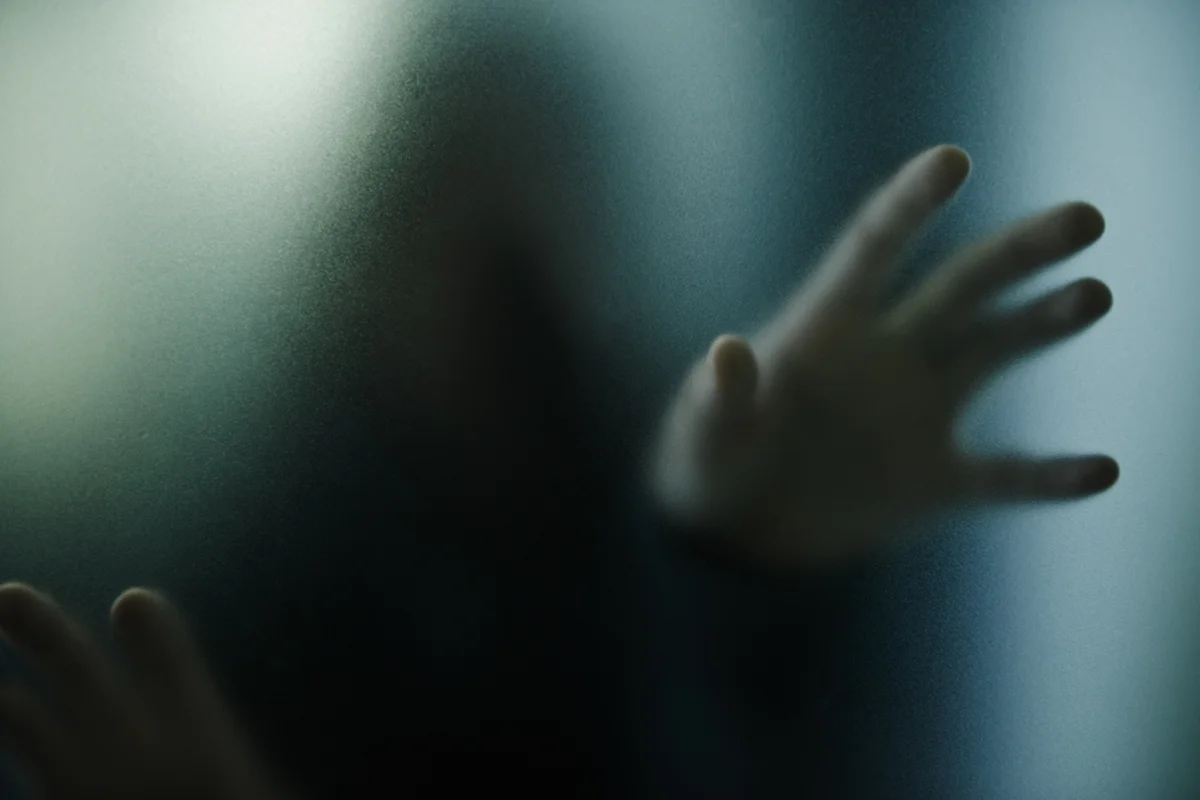 Scary, mystery and person with hand on glass