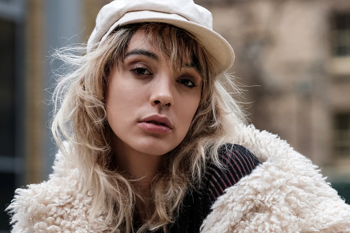 Sweet portrait of expressive alternative young model outdoors